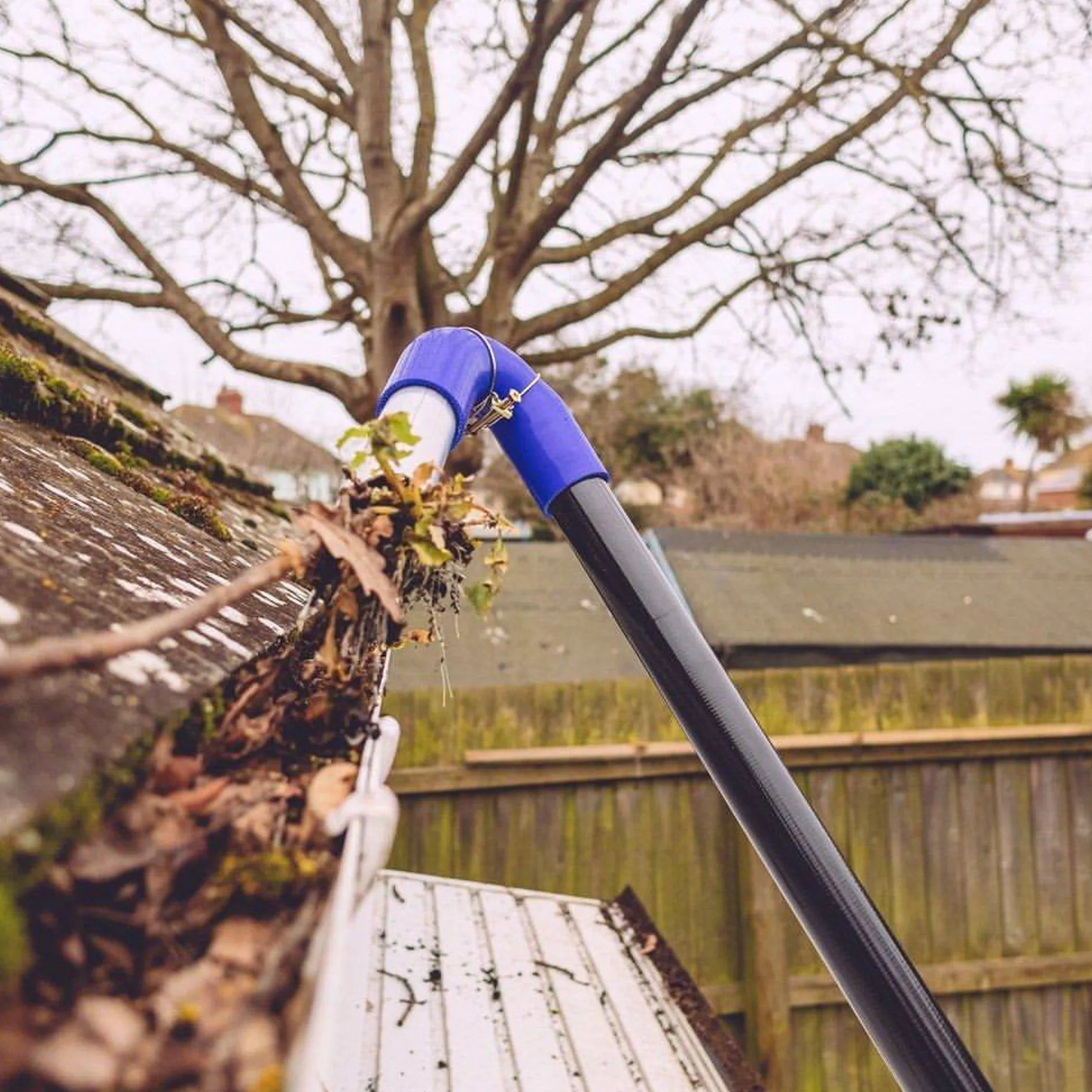 cleaning metal gutters and removing debris